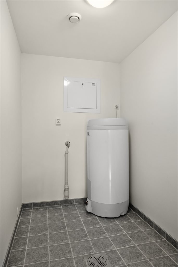 I tillegg til badet, har leiligheten eget vaskerom